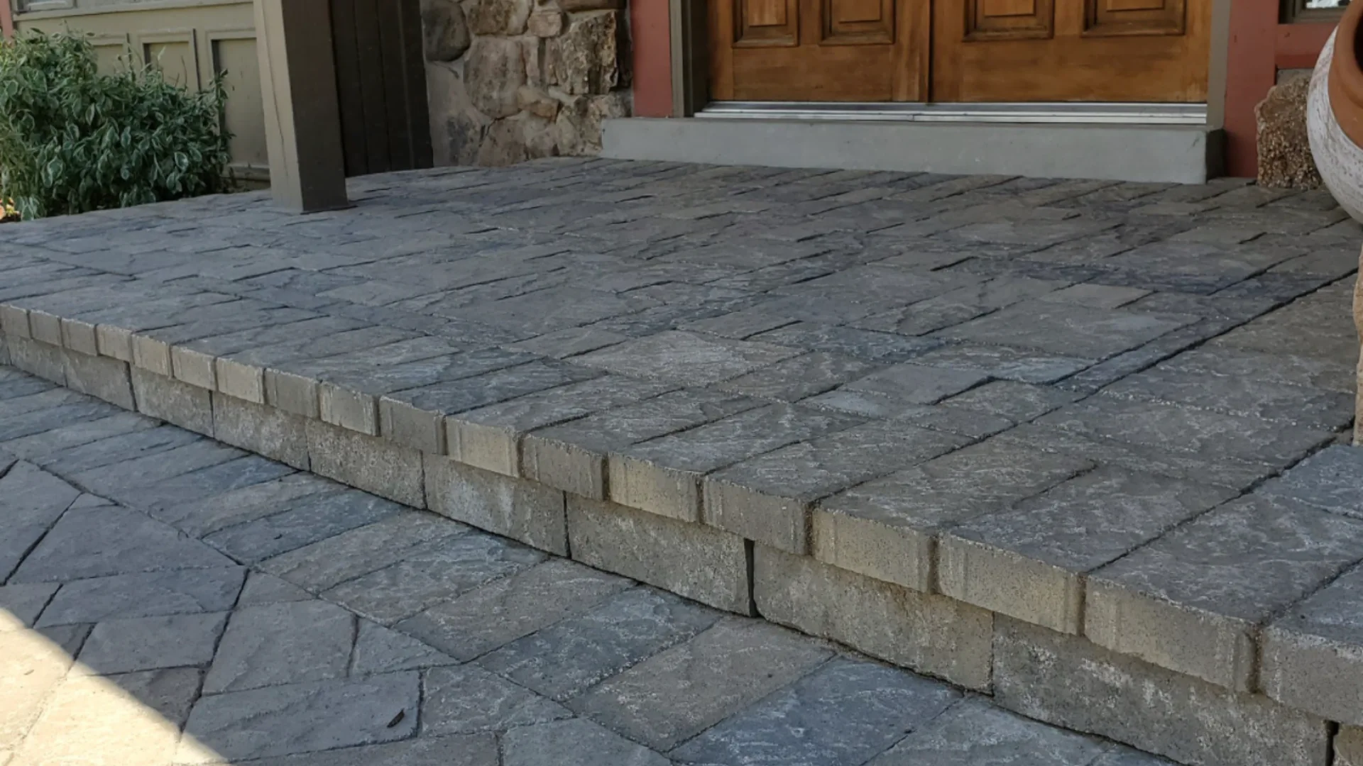 How to Put a Paver Walkway Over a Concrete Walkway